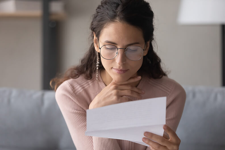 Woman opening mail