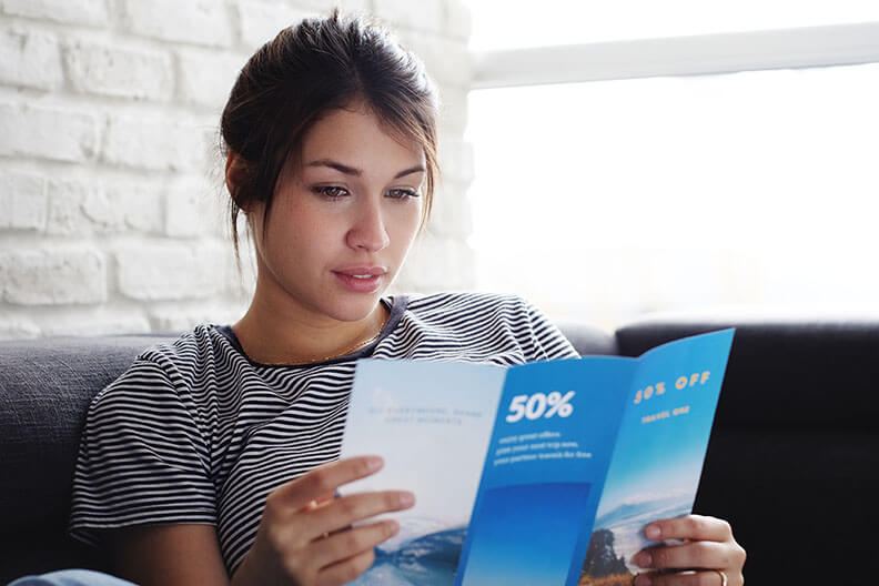 Woman reading flyer